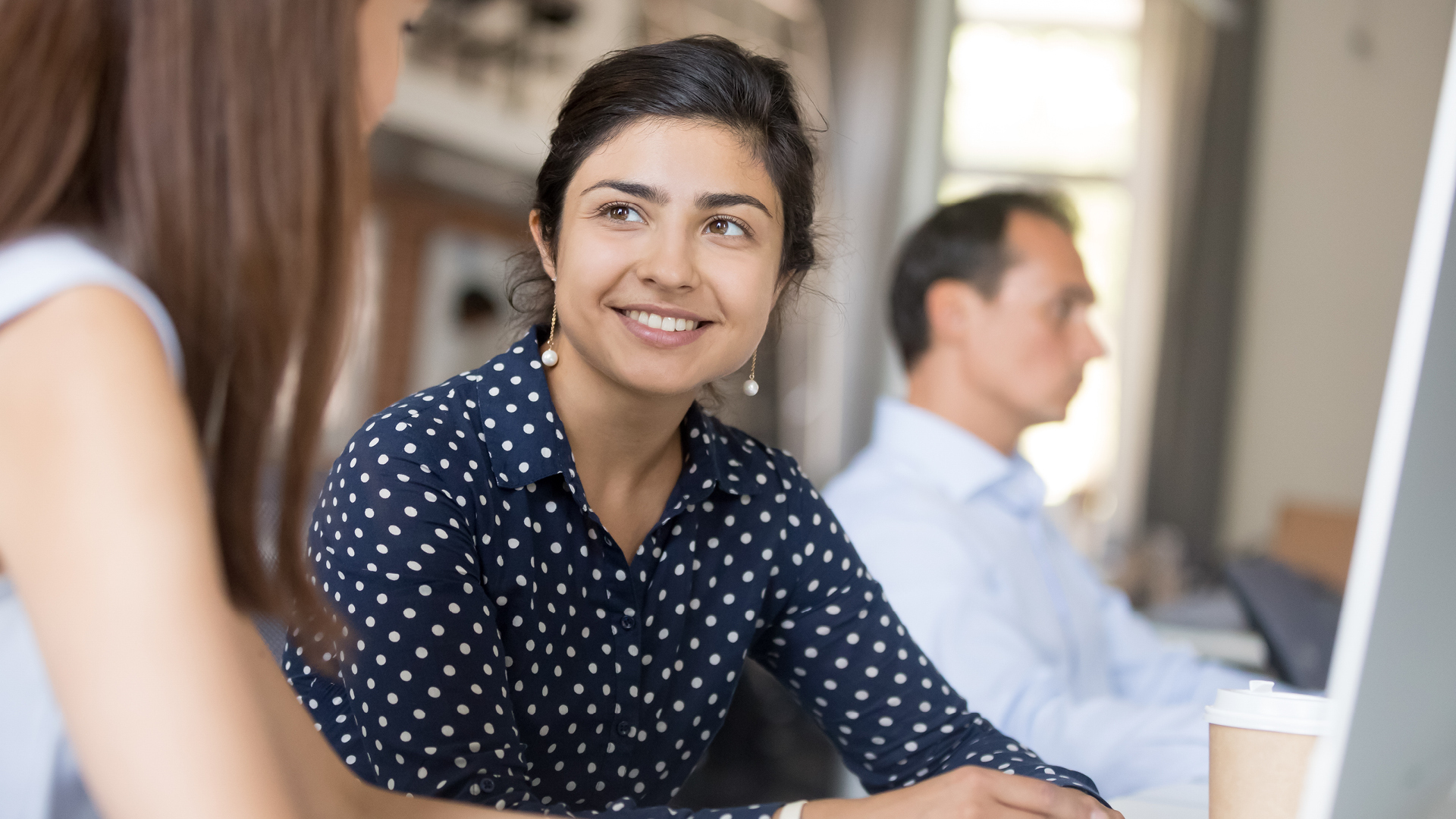 people talking side by side at an event